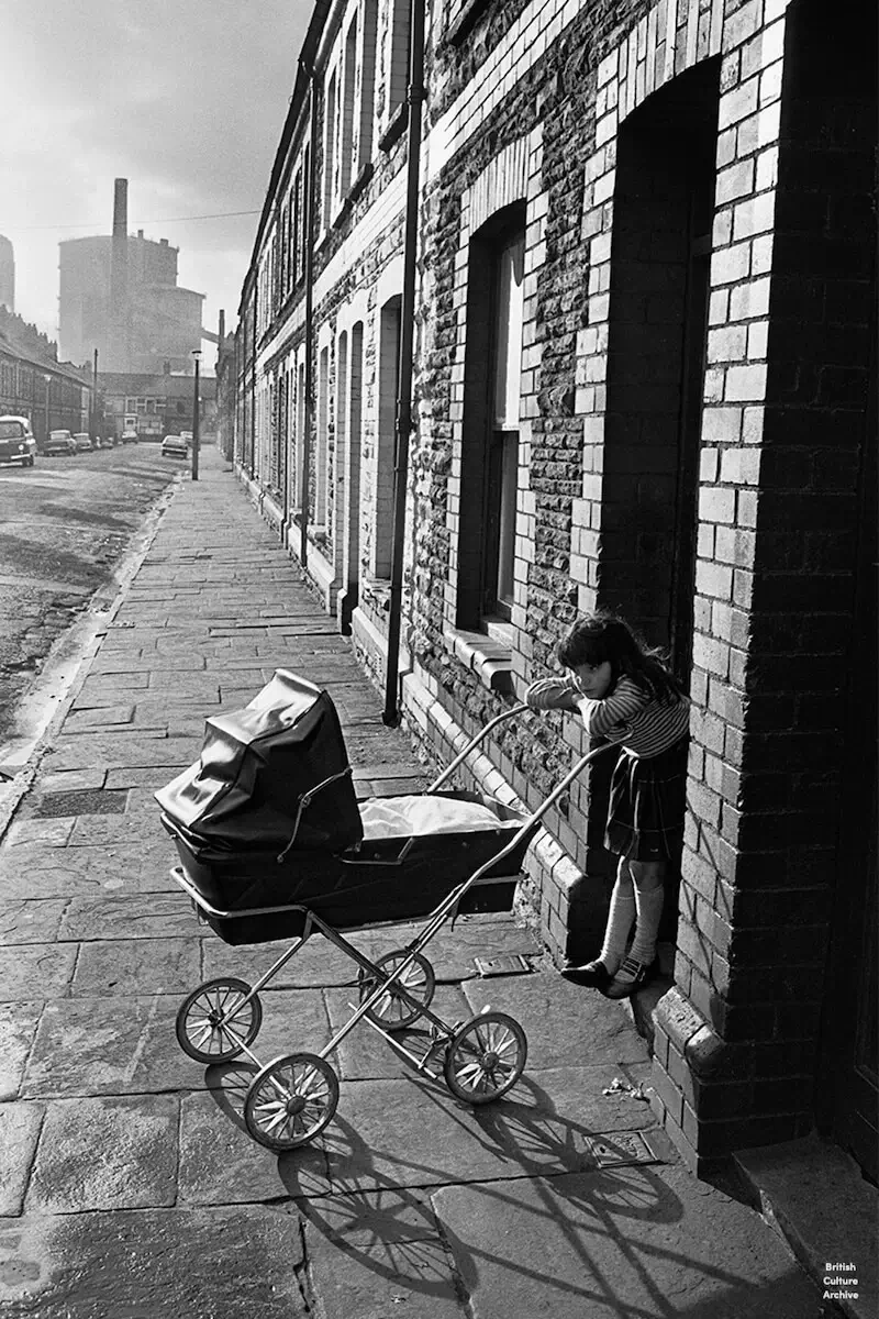 Minding the baby. Splott, Cardiff, 1974.